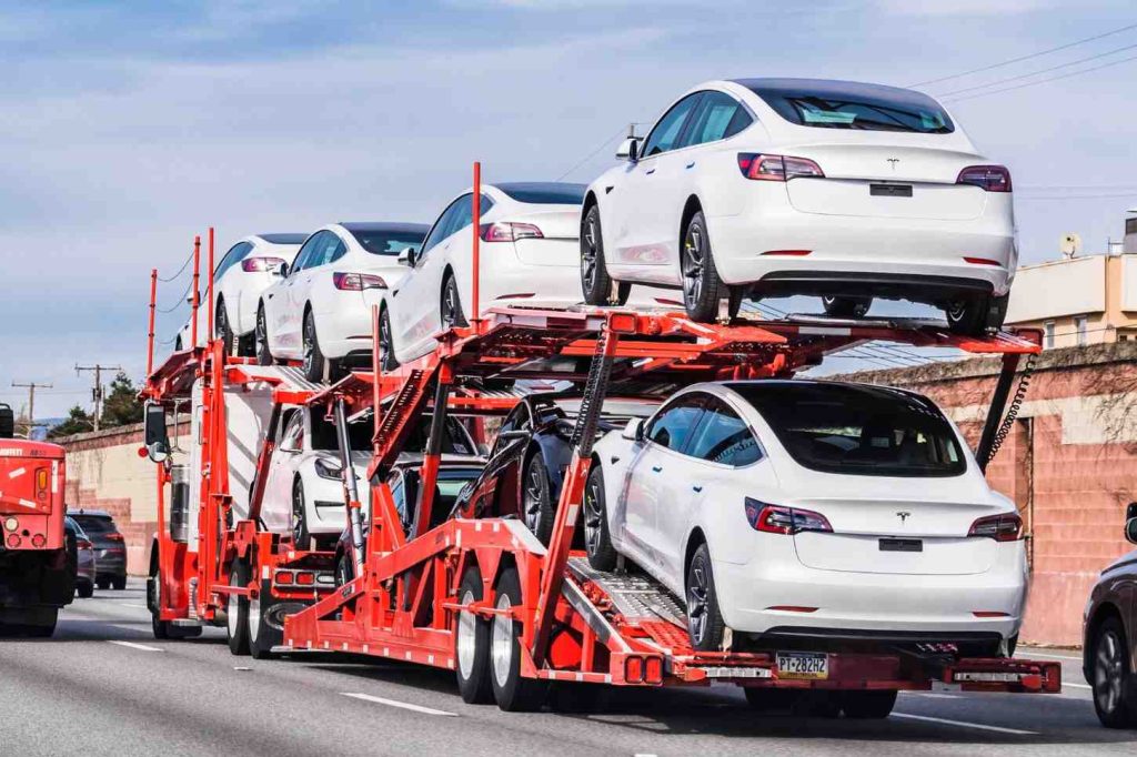 Teslas on an open car carrier