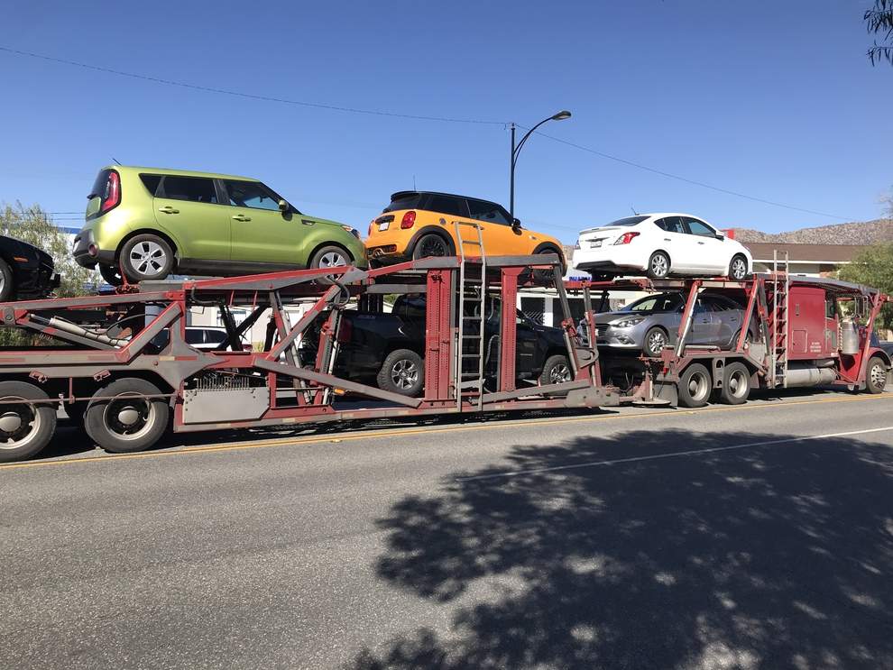 Car carrier with multiple vehicles loaded; Car Transport Questions