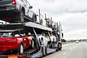 Cars loaded on an open car carrier