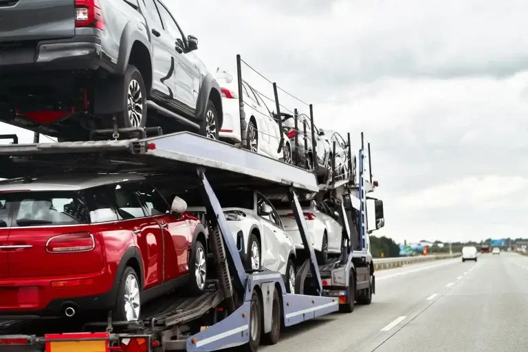 Cars loaded on an open car carrier